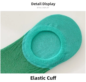 Detailed close-up of elastic ribbed cuff and shimmering green sequin knit fabric