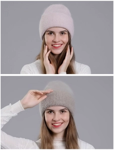 Close-up of pink and brown knit rabbit fur beanie hats with soft winter textures