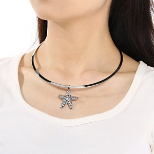 Detail shot of a sleek silver choker featuring a textured starfish pendant on a model