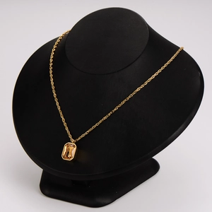 French champagne sugar cube necklace with amber hexagonal pendant on gold chain