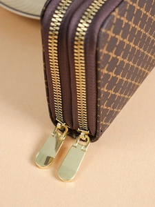 Brown long wallet with double zippers featuring vintage print and gold hardware details
