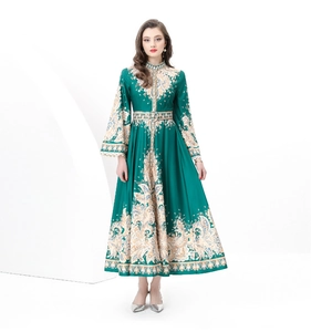 Detail of elegant paisley print on court style long sleeve dress with waist belt