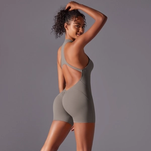 Close-up of matte grey yoga bodysuit featuring open back and scrunch butt detail