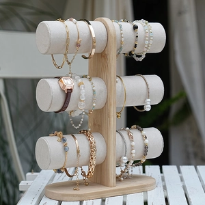 Three-tier bamboo jewelry display stand for bracelets and watches with grey velvet