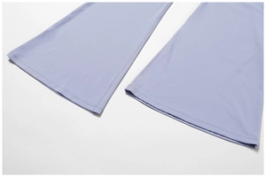 Detail of lavender high-waist yoga flared pants showing double-stitched hem and matte fabric