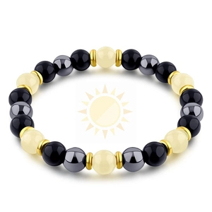 Macro shot of tiger eye bracelet with hematite beads and luminous stones on white background
