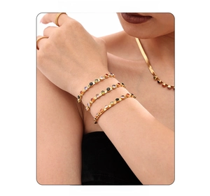 Detail of 18k gold plated necklace and bracelet set with colorful round zircon stones
