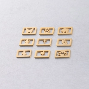 Detailed grid of nine 18k gold plated stainless steel pendants with cut-out designs