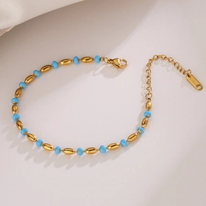 Tree of Life beaded bracelet with gold oval links and sky blue beads in stainless steel