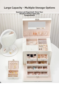 Close-up of white jewelry box with multi-layer drawers, mirror and pink velvet lining