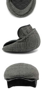 Detail of grey plaid flat cap with quilted warm lining and retractable ear flaps