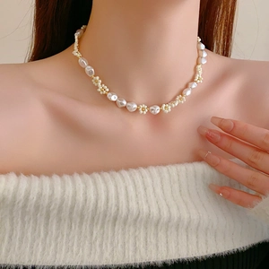 Close-up of elegant pearl flower beaded necklace worn on neck for women's jewelry