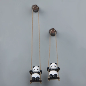 Detailed view of creative panda swing figurines with natural hemp rope and wood hooks