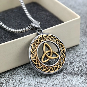 Vintage stainless steel Celtic knot necklace with gold and silver tone circular pendant