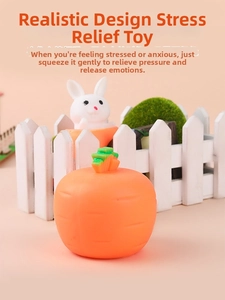 Detail shot of a creative carrot squeeze toy showing a white rabbit popping out
