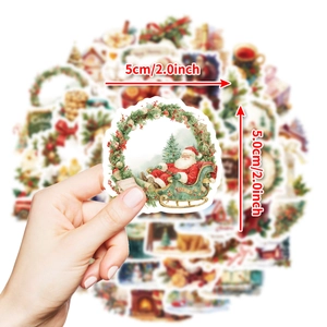 Detail showing a 5cm 2.0inch round Christmas Santa sticker held by hand for scale