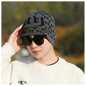 Close-up of winter knit beanie with black NY letter patterns and premium side woven label