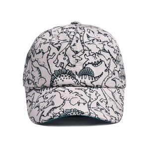 Detailed close-up of quick-dry dinosaur print fabric on the children's baseball cap