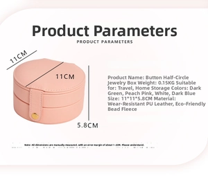 Detail of peach pink PU leather jewelry box with button closure and pearl velvet interior