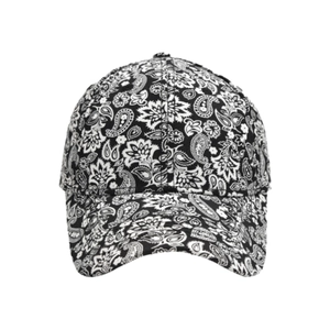 Detail of baseball cap showing black and white paisley floral pattern and curved brim
