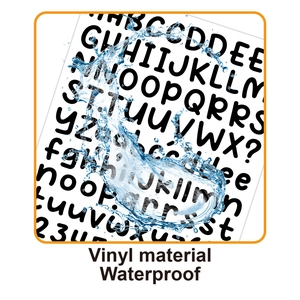 Close-up of waterproof black vinyl letter stickers showing water resistance and durability