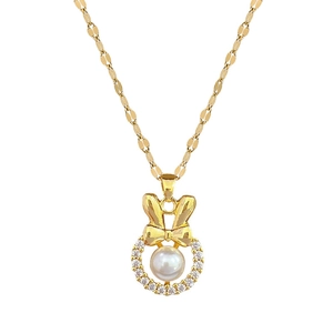 Elegant gold titanium steel necklace with a pearl bow pendant on a clean white background