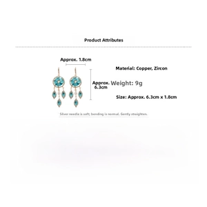 Detailed view of rose gold tassels earrings with blue circular and teardrop cubic zirconia