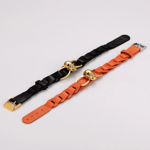 Punk skull braided leather bracelets in black and orange with golden alloy details