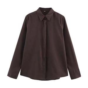 Detailed view of dark brown linen shirt featuring a classic collar and hidden button placket