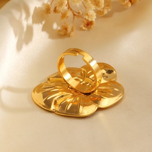 Chic 18K gold plated stainless steel floral ring with adjustable band on beige satin