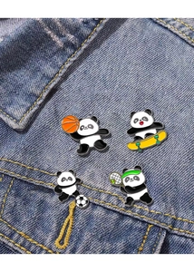 Detailed view of four panda sports enamel pins on a blue denim jacket pocket