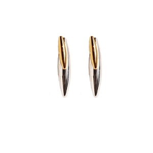 Modern two-tone gold and silver rivet stud earrings with a sleek streamlined design