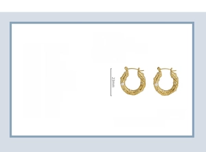 Detail of 18k gold plated U-shaped pearl earrings with inlaid rhinestones and titan steel