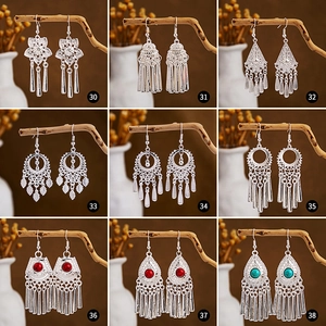 Detailed grid of vintage silver peacock earrings with tassels and ethnic hollow leaf design
