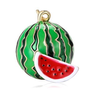 Modern enamel watermelon brooch in vibrant red and green with a polished gold finish
