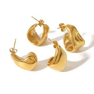 Irregular wave geometry C-shaped 18K gold-plated stainless steel earrings on white background