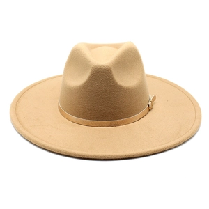 Detail of wool fedora hat with wide brim featuring a metallic gold decorative band buckle