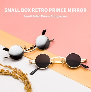 Macro detail of steampunk metal sunglasses with small round frames and temple model markings