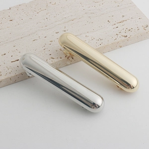 Minimalist metallic bar hair clips in polished gold and silver finish for women