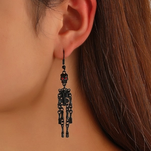 Gothic black skull dangle earrings with red eye accents for punk or Halloween style fashion