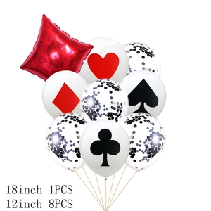 Detail of red and black poker balloons with spade, heart, club, and diamond patterns