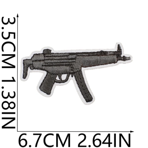 Detail view of MP5 submachine gun embroidered patch with black grey stitching and size markers