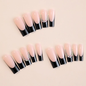 Extra long coffin press-on nails with black French tips and rainbow rhinestones