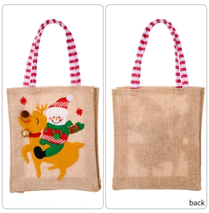Front and back detail of a linen Christmas gift bag featuring a snowman on a reindeer