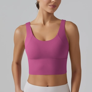 Detail of high-stretch magenta sports bra with U-neck and professional matte fabric texture