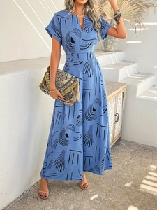 Detail of blue floral jumpsuit featuring short sleeves and elegant black geometric pattern