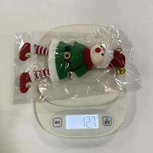 Lightweight 12.7g Christmas elf doll ornament on a scale for festive tree decorations