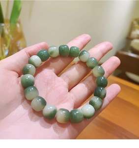 Macro detail of weathered Bodhi seed beads in natural green and white gradient