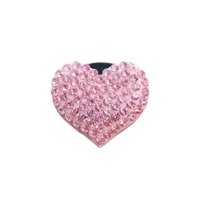 Pink heart-shaped phone socket with sparkling rhinestones on a white background