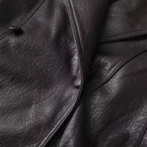 Women's oversized faux leather motorcycle jacket with lapels and detailed button accents